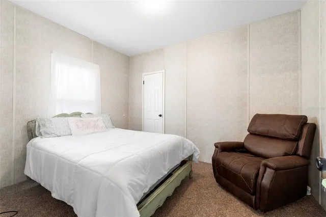 a view of a lake with a house in the background