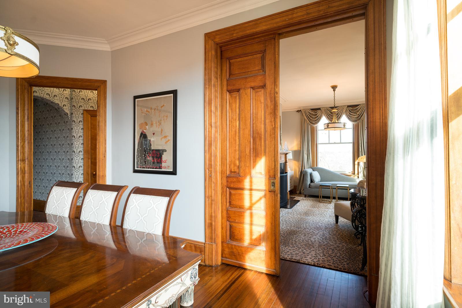 2853 Ontario Road Northwest, Unit 421 Washington, DC 20009 - Photo 12 of 35 a view of a bedroom with furniture and wooden floor