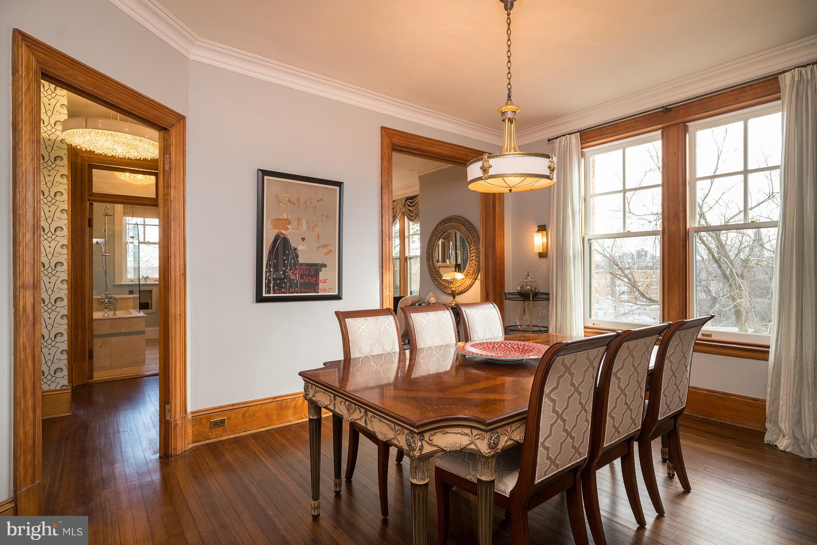 2853 Ontario Road Northwest, Unit 421 Washington, DC 20009 - Photo 10 of 35 a dining room with furniture window wooden floor