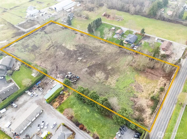 an aerial view of a houses with outdoor space