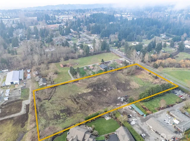 a view of a yard with swimming pool