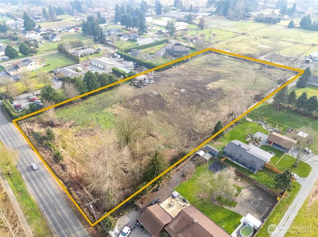 a view of a yard with wooden floor