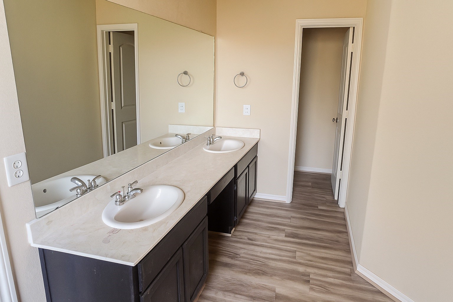 15602 Egret Field Lane Houston, TX 77049 - Photo 6 of 11 a en suite bathroom with a double vanity sink and a mirror