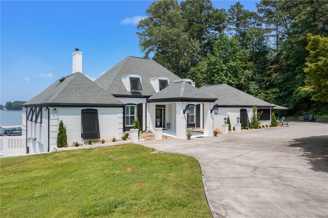 408 Northampton Road Seneca, SC 29672 - Photo 2 of 49 Boasting 4,986 sq. feet of finished space, this stately white brick home has been thoughtfully updated to preserve traditional character while introducing modern conveniences throughout.
