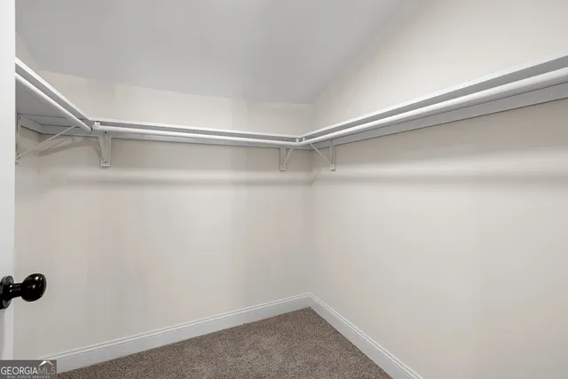 a view of wooden floor and entryway in a room