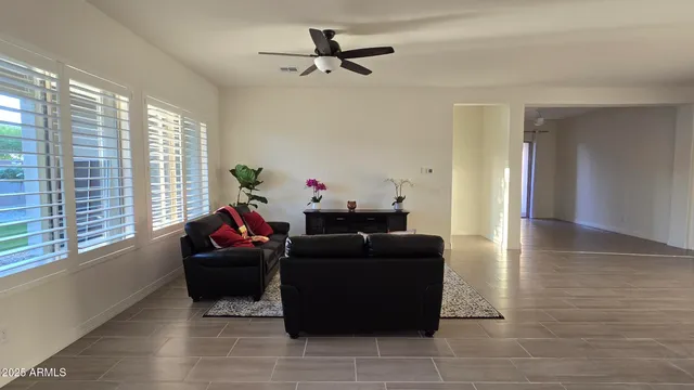a living room with furniture and a window