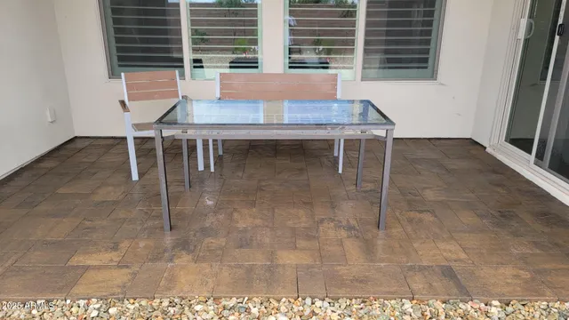 a living room with a table and chairs