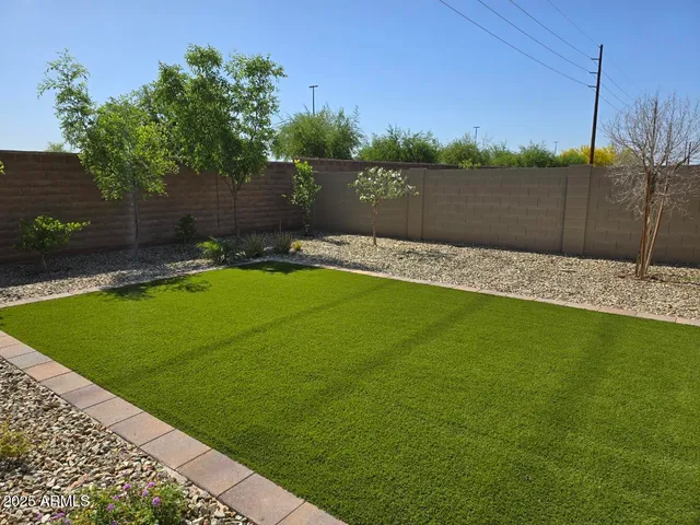 a view of a backyard with a lake view