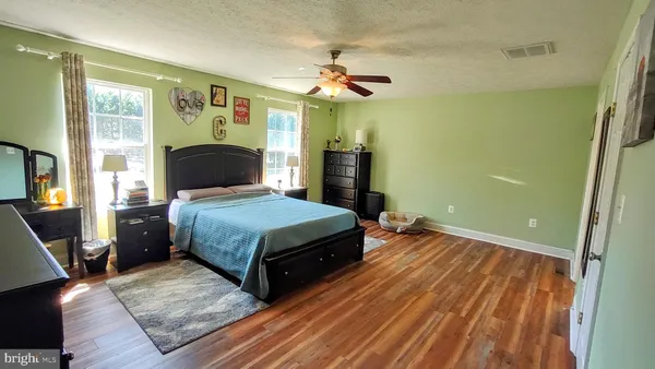 a bathroom with a toilet and a shower curtain
