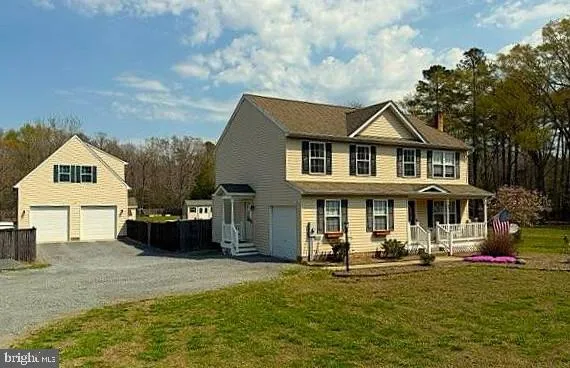 a kitchen with stainless steel appliances granite countertop a refrigerator a sink a stove and island