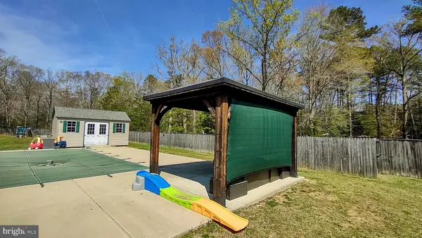 a bathroom with a toilet and a mirror