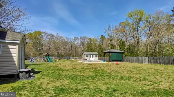 a view of kitchen with cabinets and wooden floor