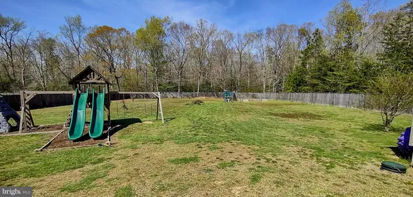 a bedroom with a bed and a dresser in it