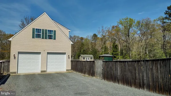 a bathroom with a sink double vanity and a mirror