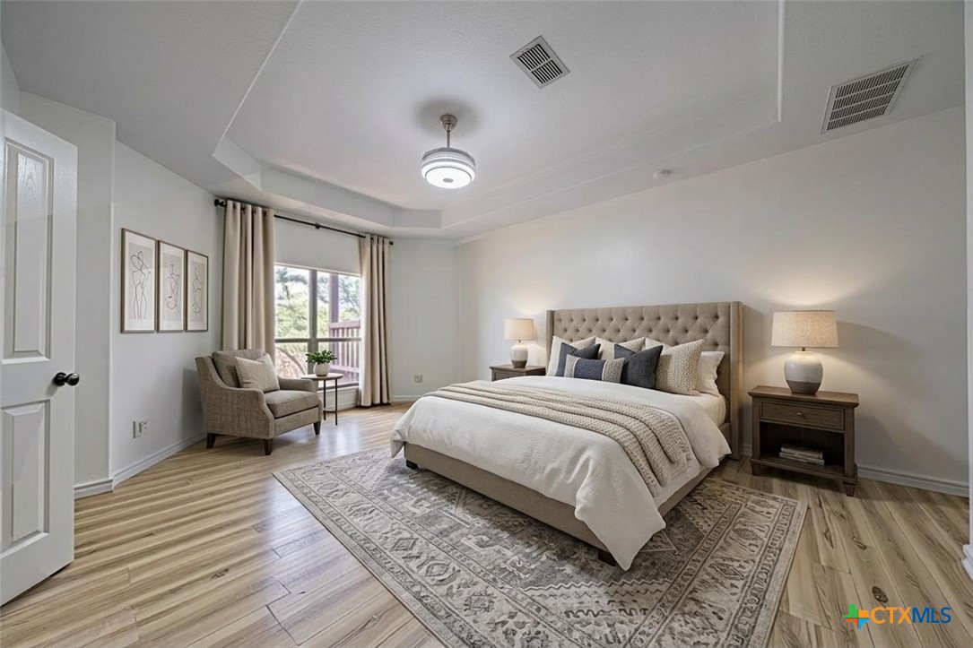 519 Long Meadow Spring Branch, TX 78070 - Photo 16 of 33 a spacious bedroom with a bed and a couch