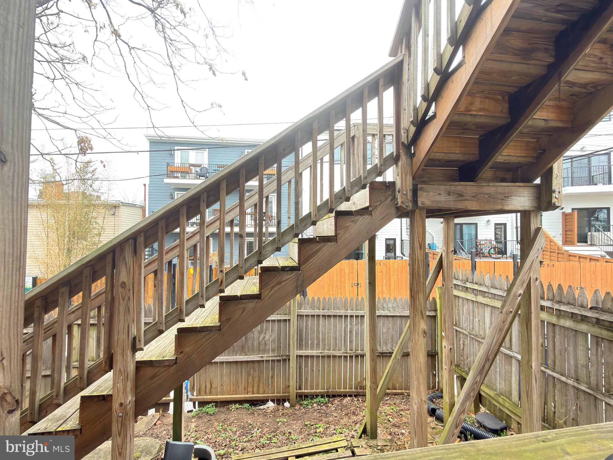 1246 Queen Street Northeast, Unit 2 Washington, DC 20002 - Photo 20 of 23 Charming wooden staircase to outdoor retreat.