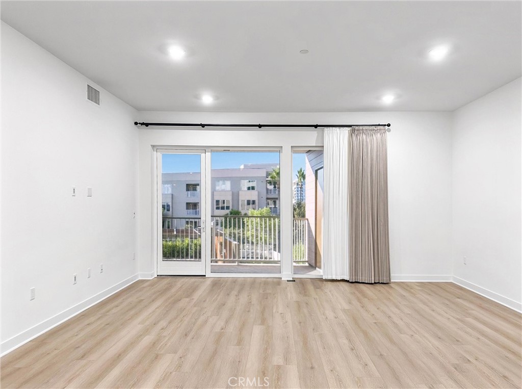 4302 Rivington Irvine, CA 92612 - Photo 13 of 62 wooden floor in an empty room with a window