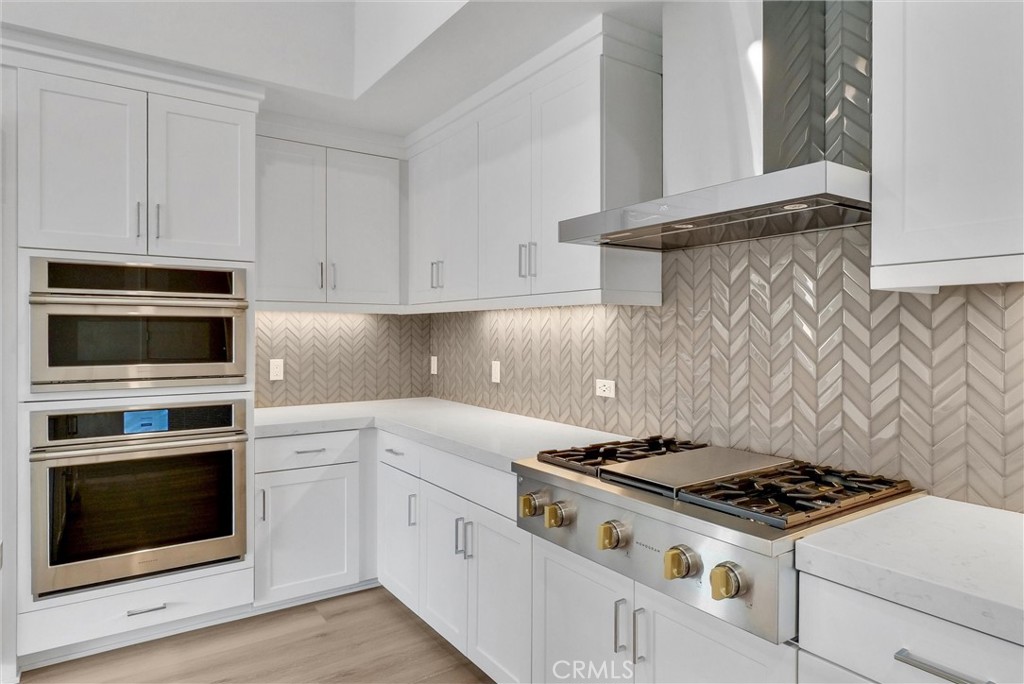 4302 Rivington Irvine, CA 92612 - Photo 20 of 62 a white stove top oven sitting inside of a kitchen