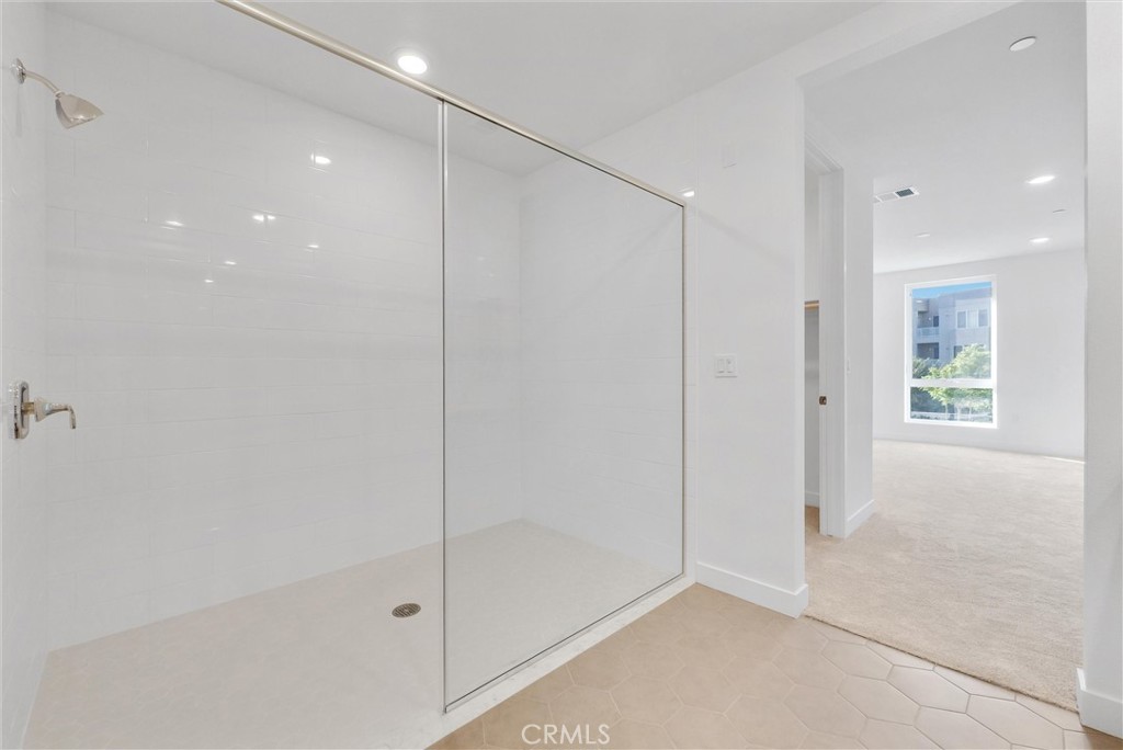 4302 Rivington Irvine, CA 92612 - Photo 33 of 62 a bathroom with a shower and a glass door