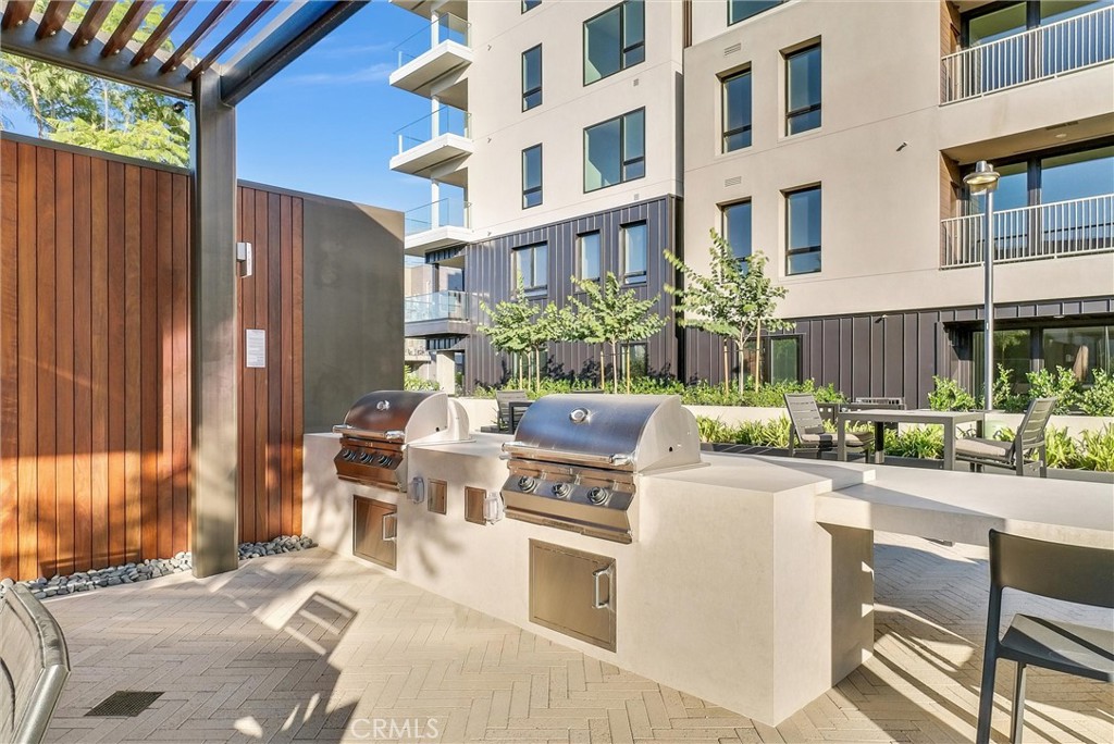 4302 Rivington Irvine, CA 92612 - Photo 57 of 62 a view of a patio with table and chairs and potted plants