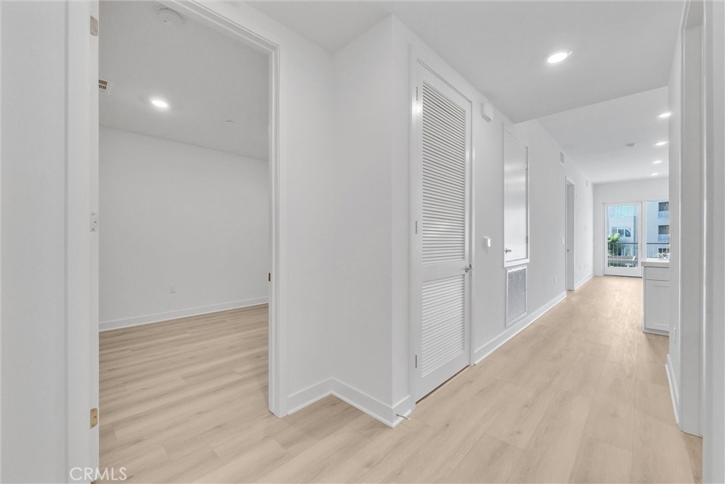 4302 Rivington Irvine, CA 92612 - Photo 6 of 62 a view of a hallway with wooden floor