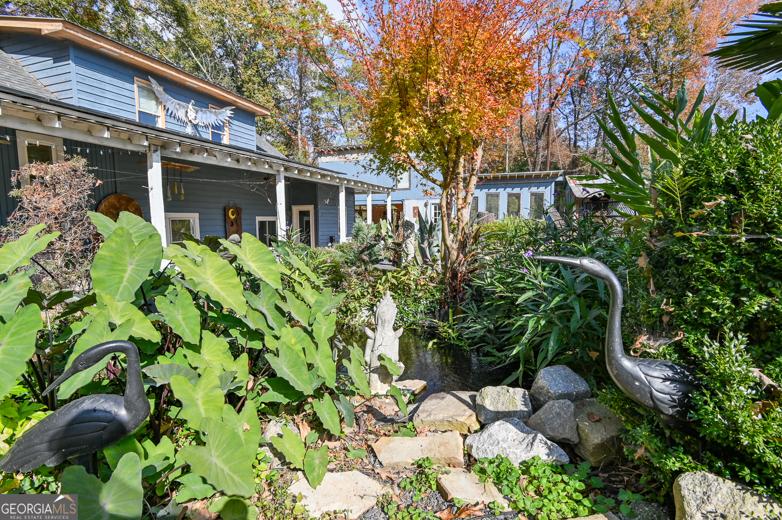 11725 Hazelbrand Road Northeast Covington, GA 30014 - Photo 12 of 71 a front view of a house with a garden