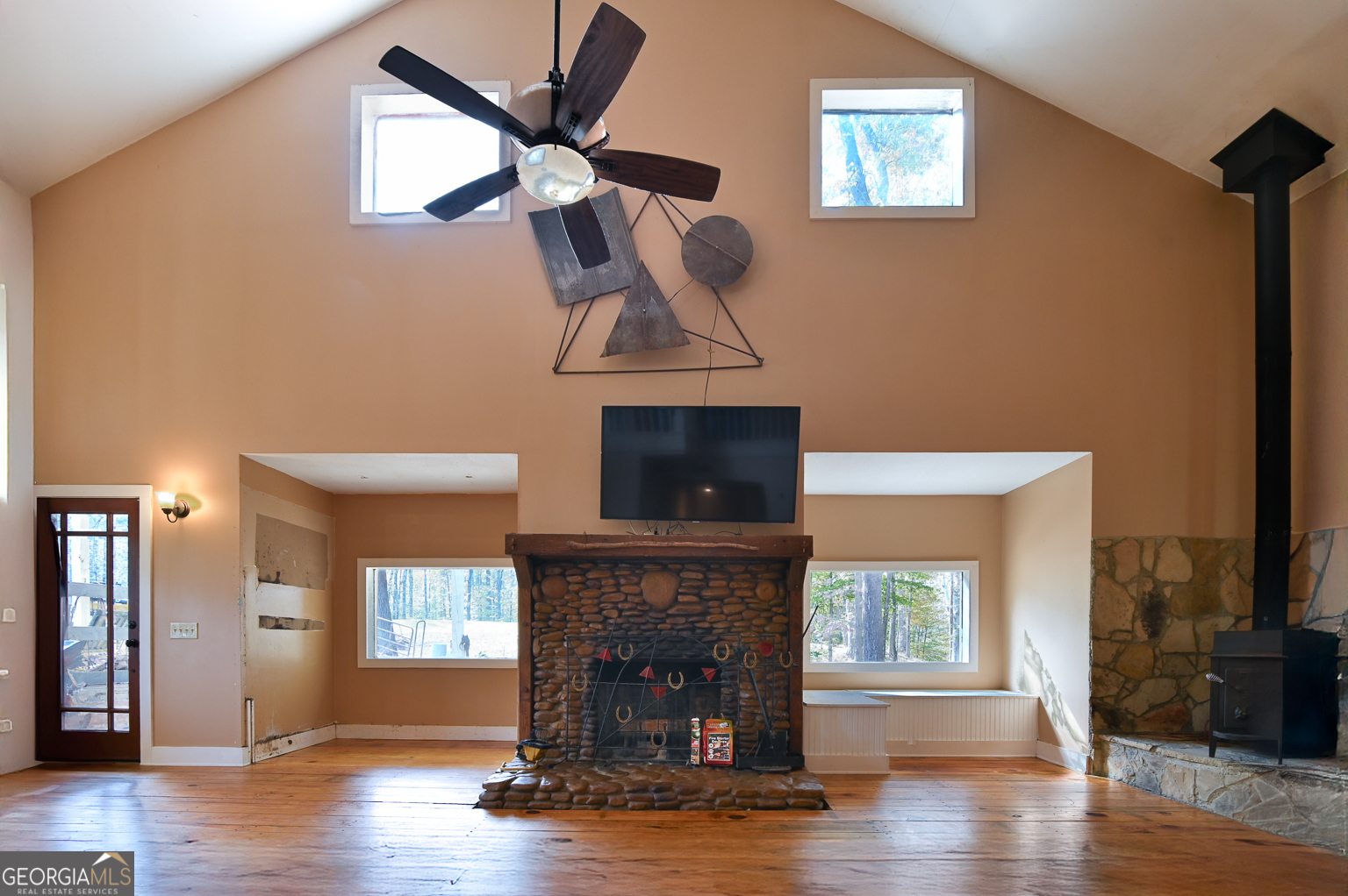 11725 Hazelbrand Road Northeast Covington, GA 30014 - Photo 21 of 71 a living room with furniture and a fireplace