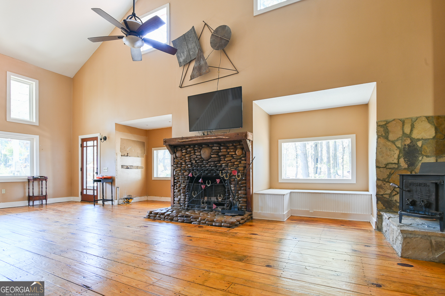 11725 Hazelbrand Road Northeast Covington, GA 30014 - Photo 22 of 71 a living room with fireplace furniture and a wooden floor