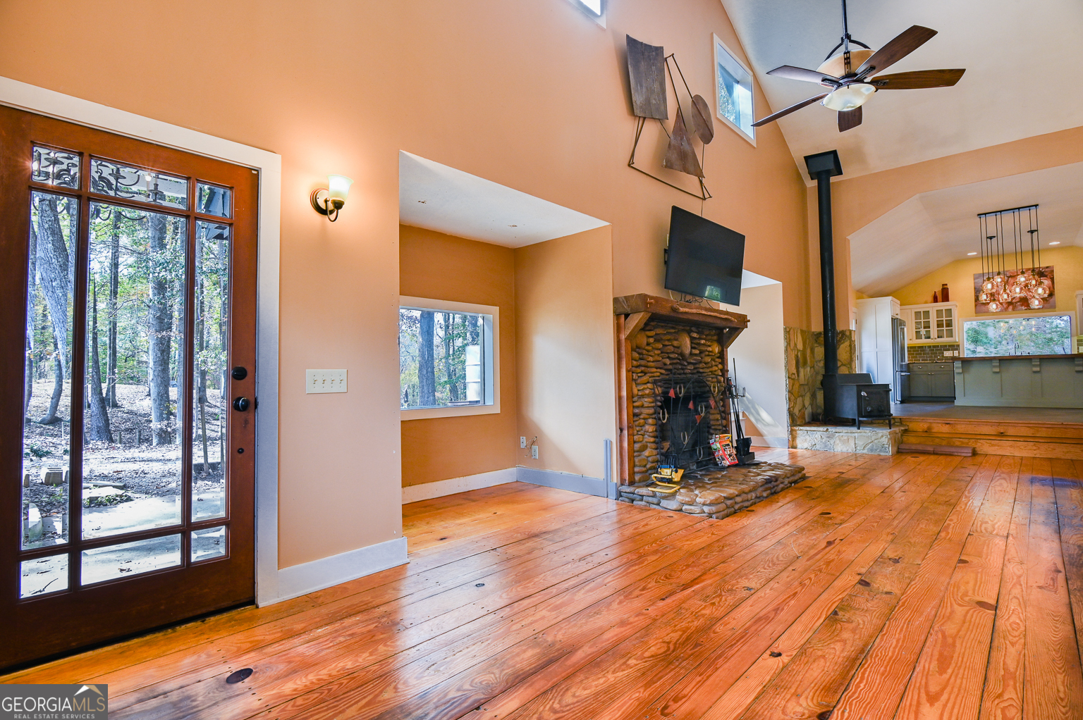 11725 Hazelbrand Road Northeast Covington, GA 30014 - Photo 23 of 71 a view of a livingroom with wooden floor and a fireplace