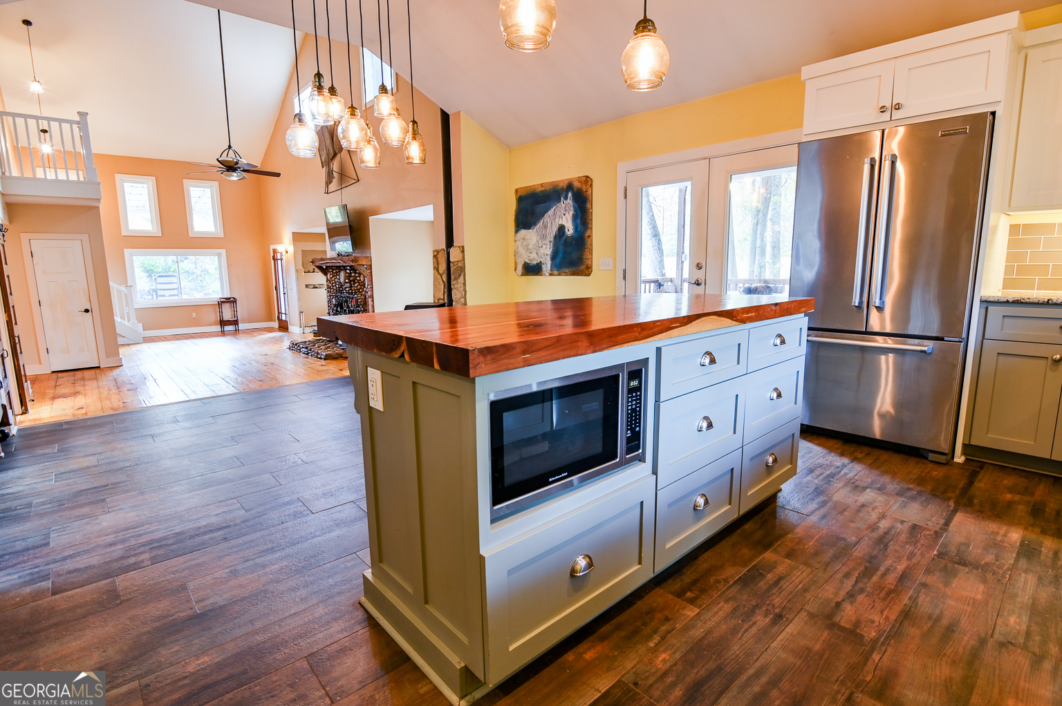 11725 Hazelbrand Road Northeast Covington, GA 30014 - Photo 25 of 71 a kitchen with stainless steel appliances a stove top oven and a refrigerator