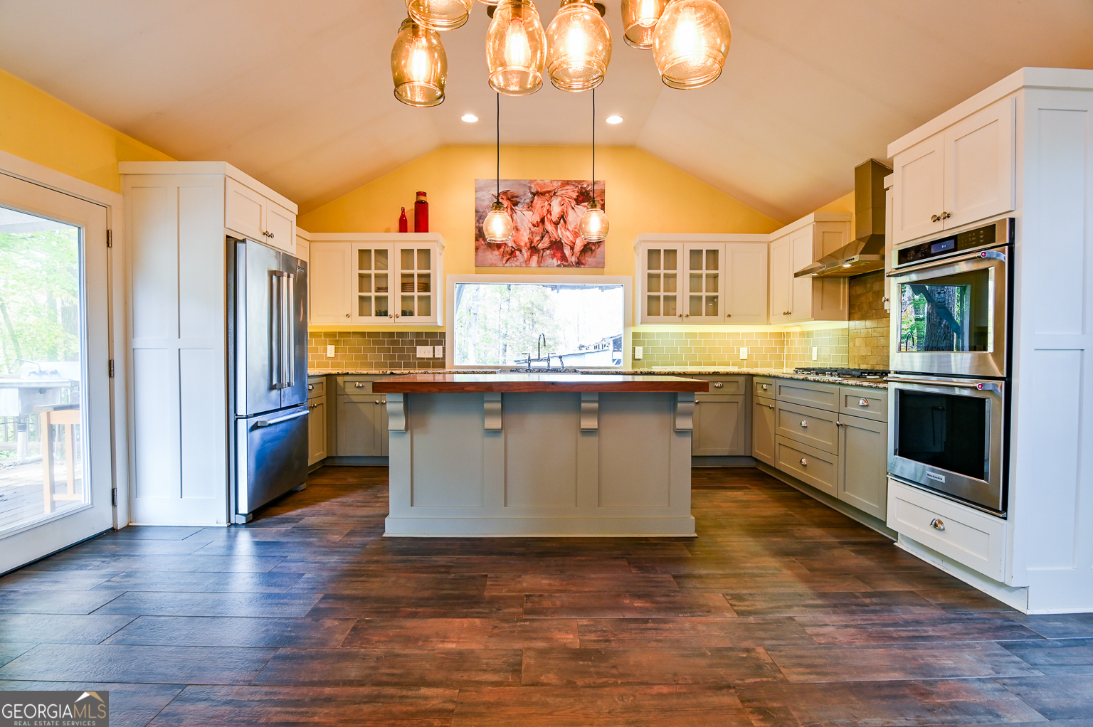 11725 Hazelbrand Road Northeast Covington, GA 30014 - Photo 26 of 71 a kitchen with stainless steel appliances granite countertop a stove a sink and a refrigerator