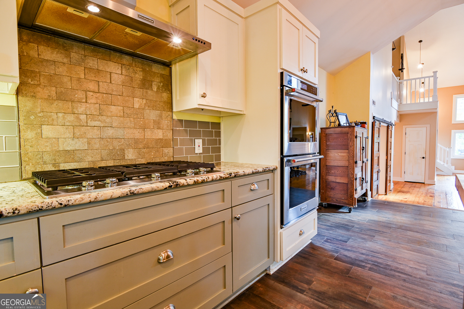 11725 Hazelbrand Road Northeast Covington, GA 30014 - Photo 30 of 71 a kitchen with stainless steel appliances granite countertop a stove and a refrigerator