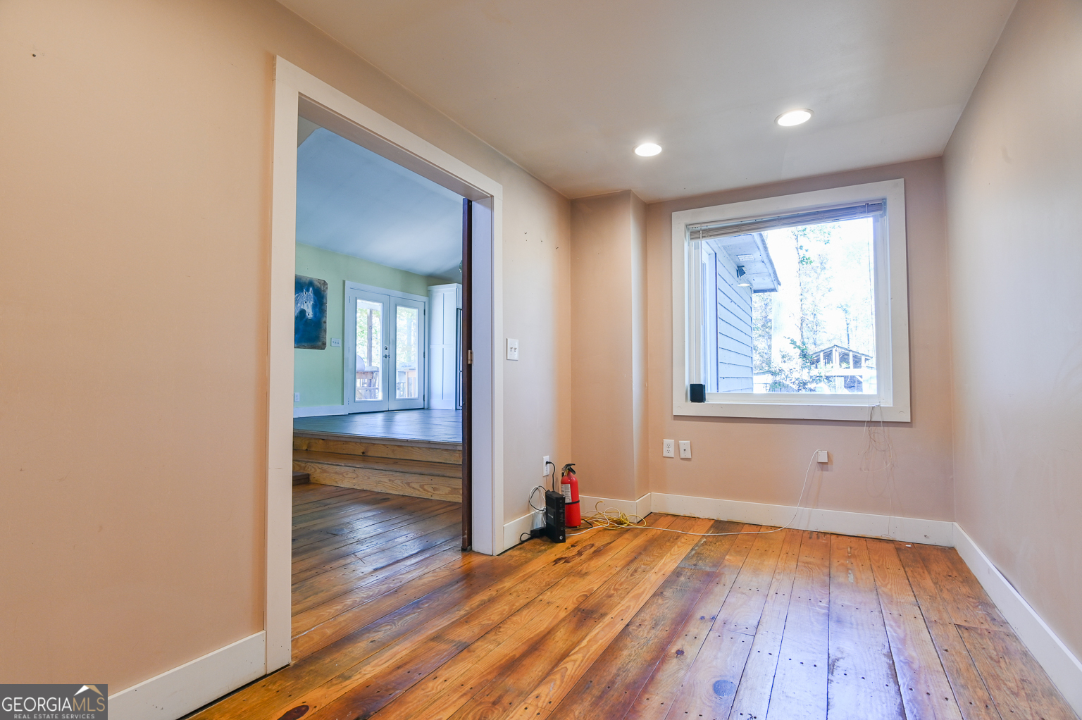 11725 Hazelbrand Road Northeast Covington, GA 30014 - Photo 32 of 71 wooden floor in an empty room with a window