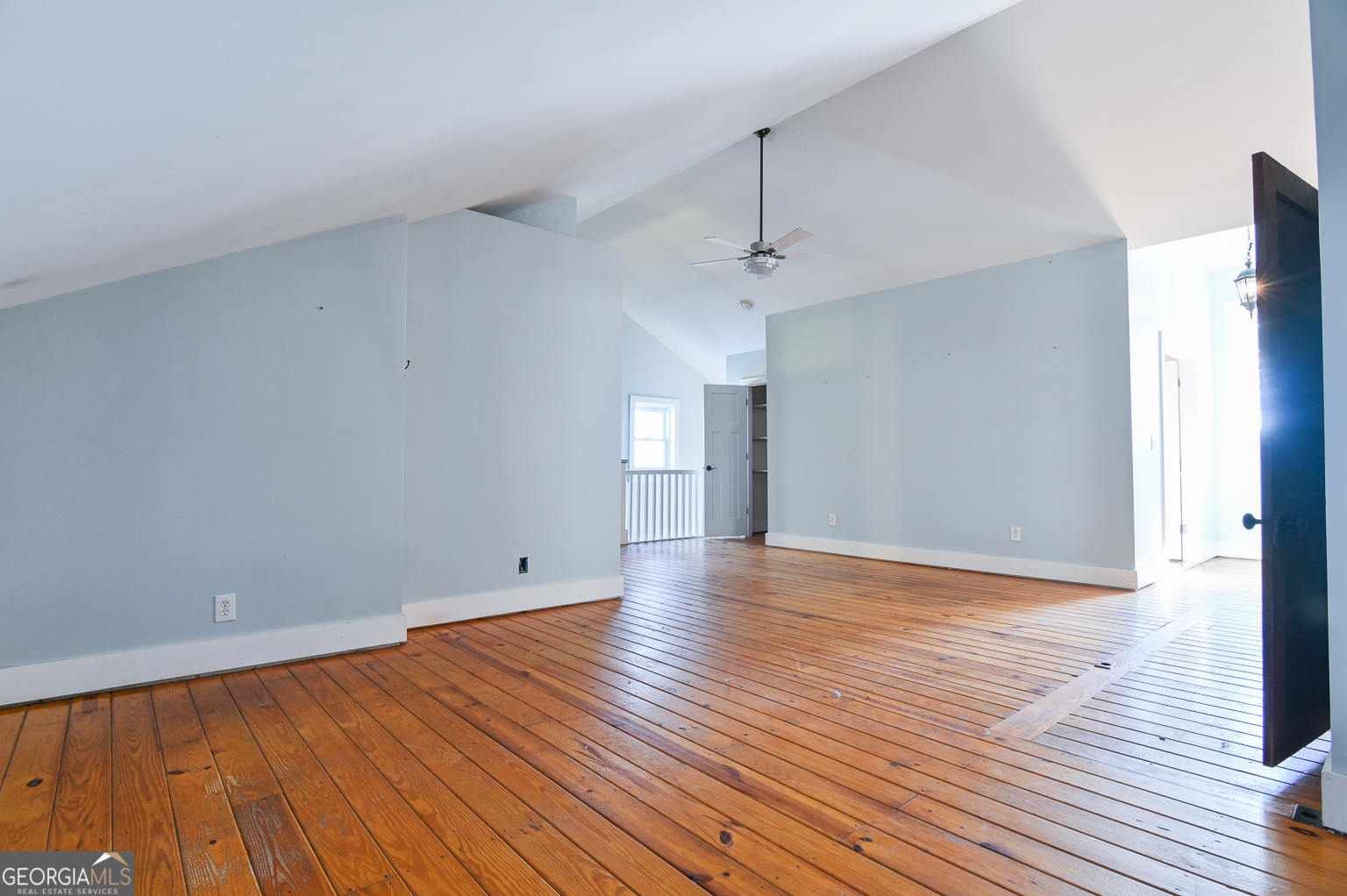 11725 Hazelbrand Road Northeast Covington, GA 30014 - Photo 51 of 71 a view of empty room with wooden floor and fan