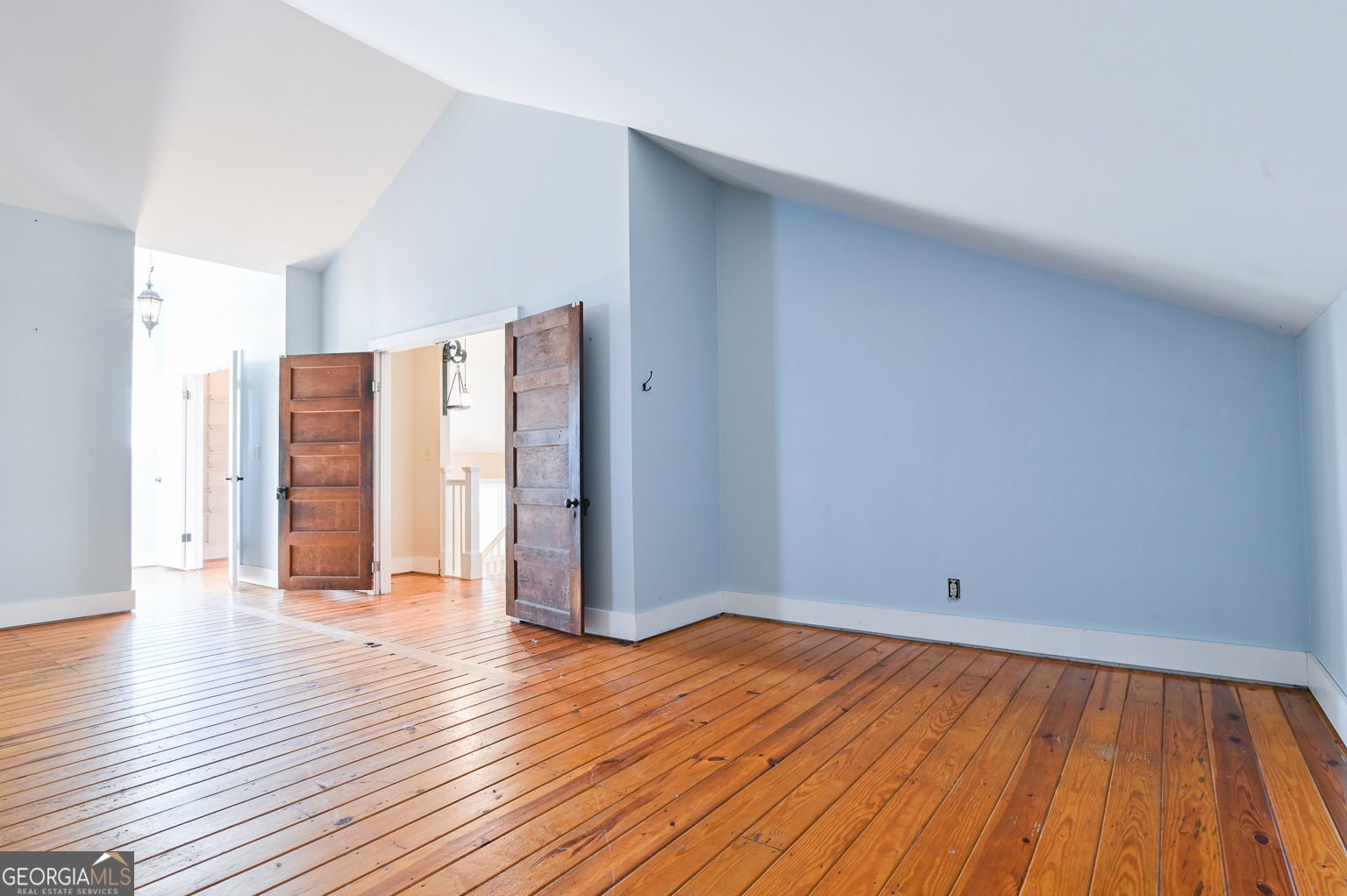 11725 Hazelbrand Road Northeast Covington, GA 30014 - Photo 53 of 71 a view of an empty room with wooden floor