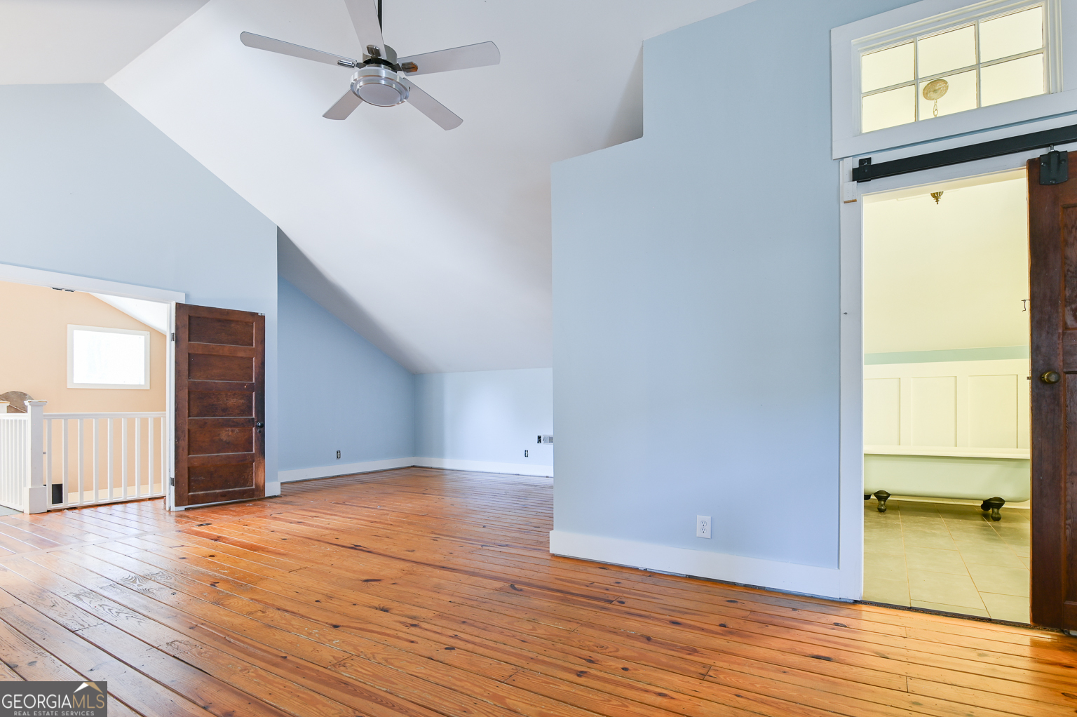11725 Hazelbrand Road Northeast Covington, GA 30014 - Photo 54 of 71 an empty room with wooden floor and windows
