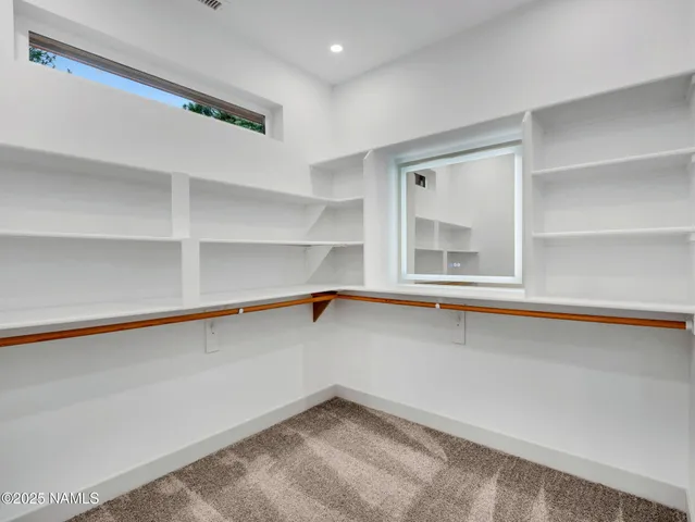 a view of a lake with a city from a balcony