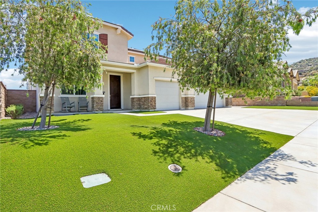 11056 Guffey Ranch Way Corona, CA 92883 - Photo 4 of 61 a view of a house with a yard and tree s
