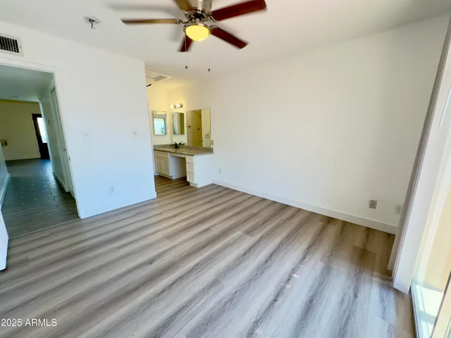 a bathroom with a sink and shower