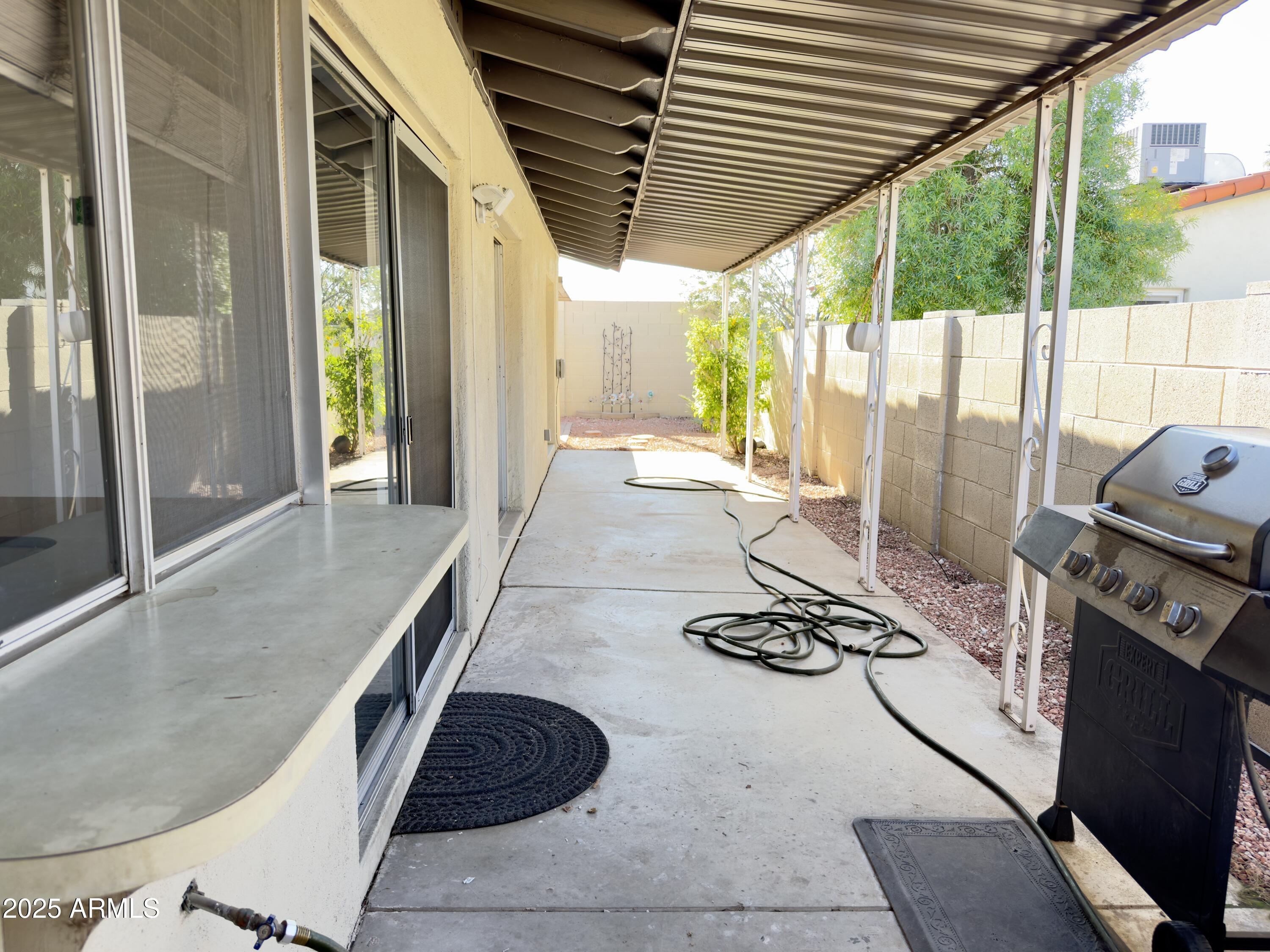 1021 West Mission Lane Phoenix, AZ 85021 - Photo 17 of 20 a kitchen with stainless steel appliances granite countertop a stove a sink and a refrigerator