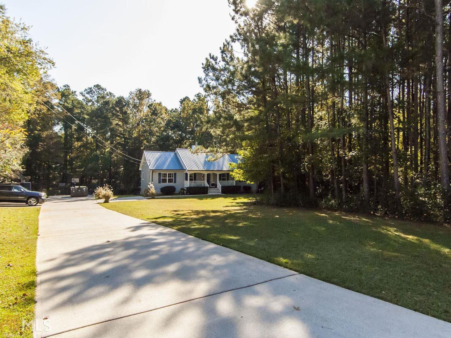 1487 North Van Wert Road, Unit 20 Villa Rica, GA 30180 - Photo 1 of 1 a swimming pool with outdoor seating and yard