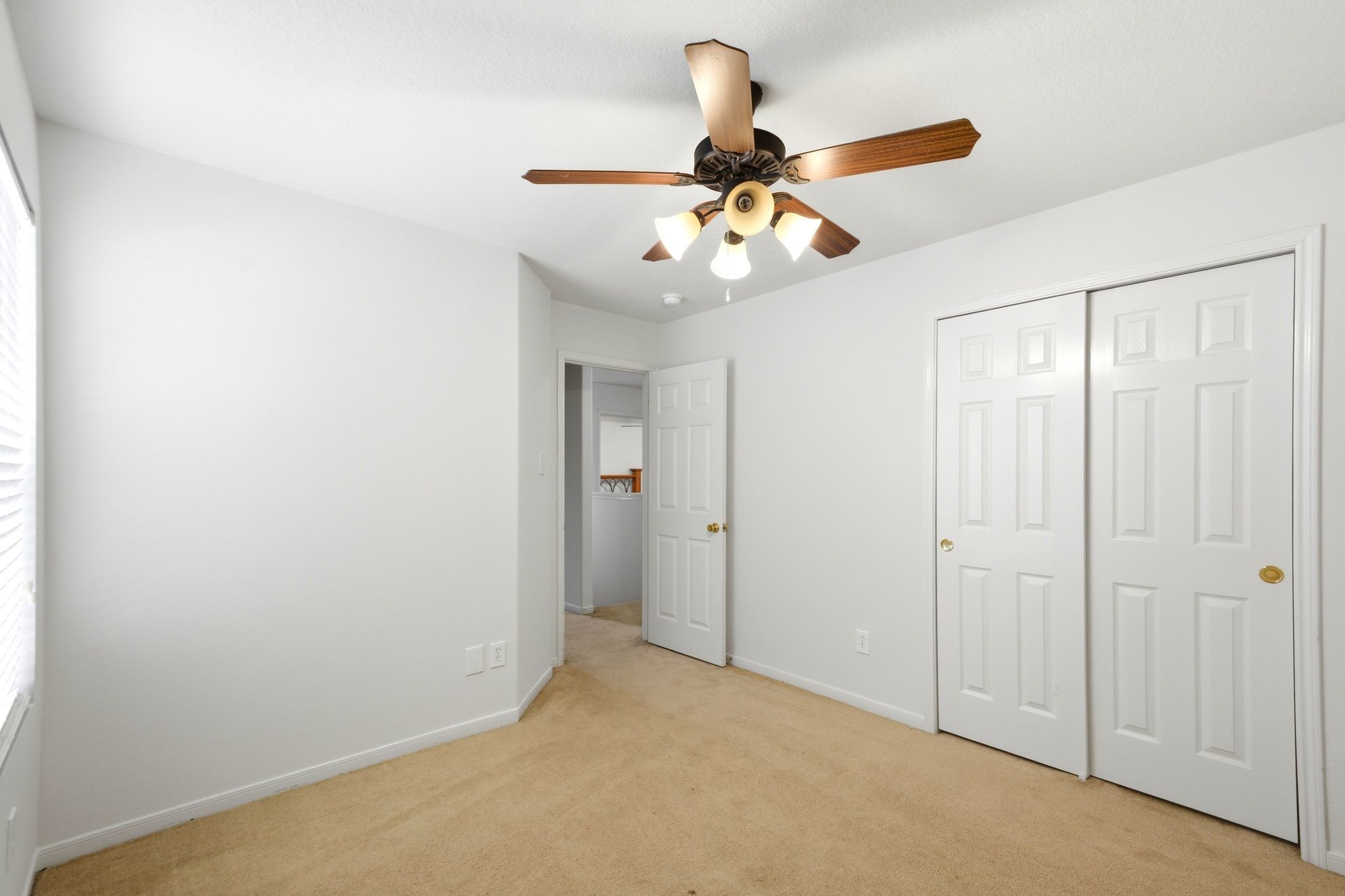 16954 Tableland Trail Conroe, TX 77385 - Photo 26 of 33 Bright and versatile bedroom featuring a ceiling fan, ample closet space, and plenty of natural light.