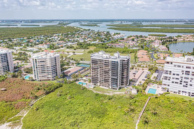 a view of a large body of water with a building in the background