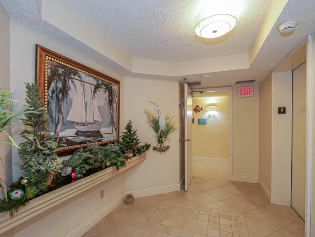 a bathroom with a sink vanity mirror and toilet