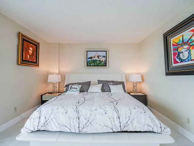 a view of a balcony with wooden floor and outdoor seating