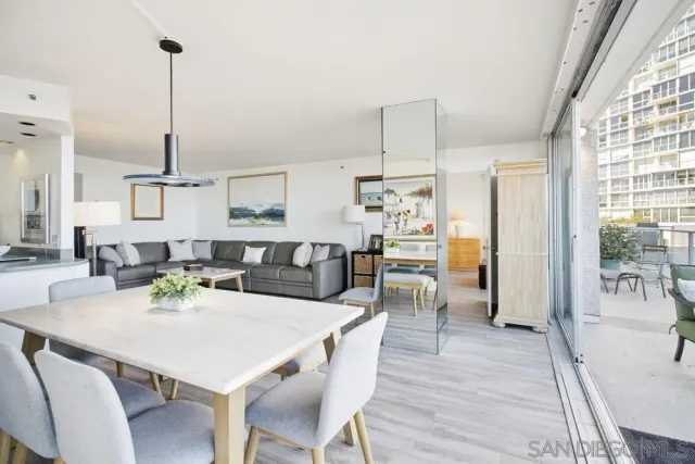 a bedroom with a bed and painting on the wall