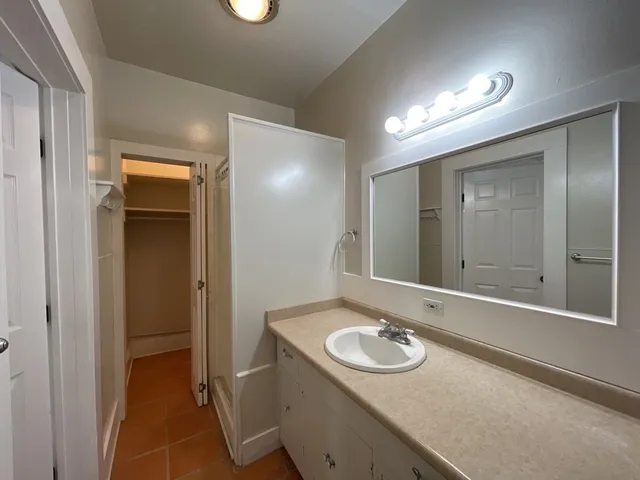 a bathroom with a sink and mirror