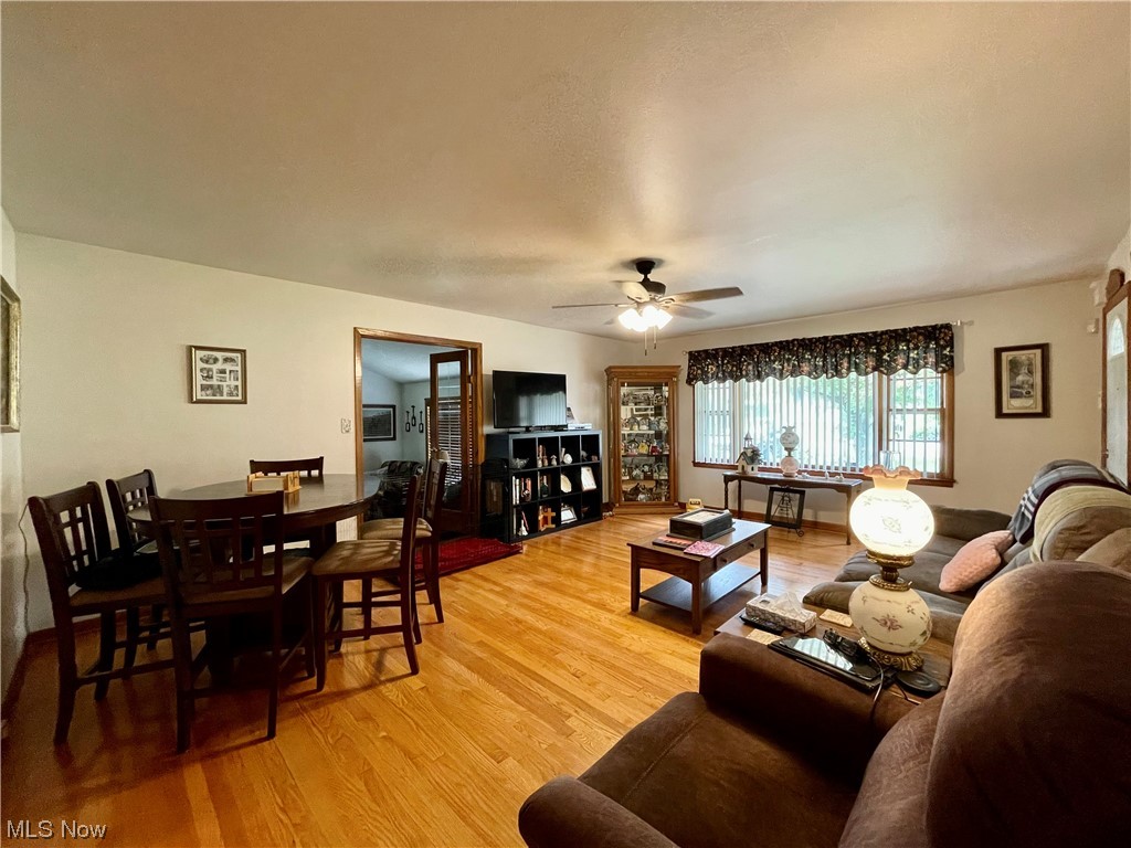 66119 Highway 124 Reedsville, OH 45772 - Photo 3 of 29 Hardwood floored living room with ceiling fan