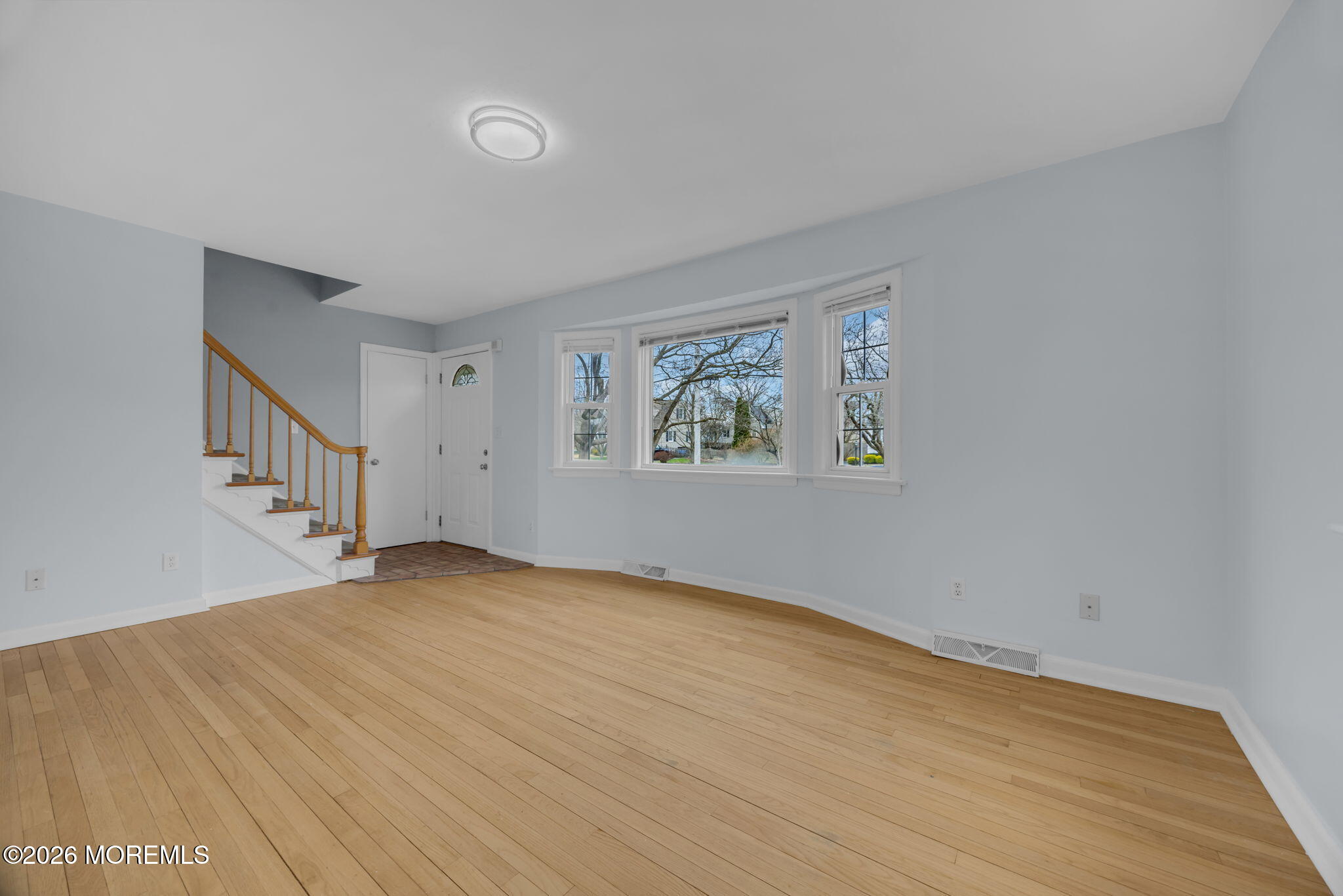 108 Susan Drive Ewing, NJ 08638 - Photo 18 of 40 a view of an empty room with wooden floor and a window