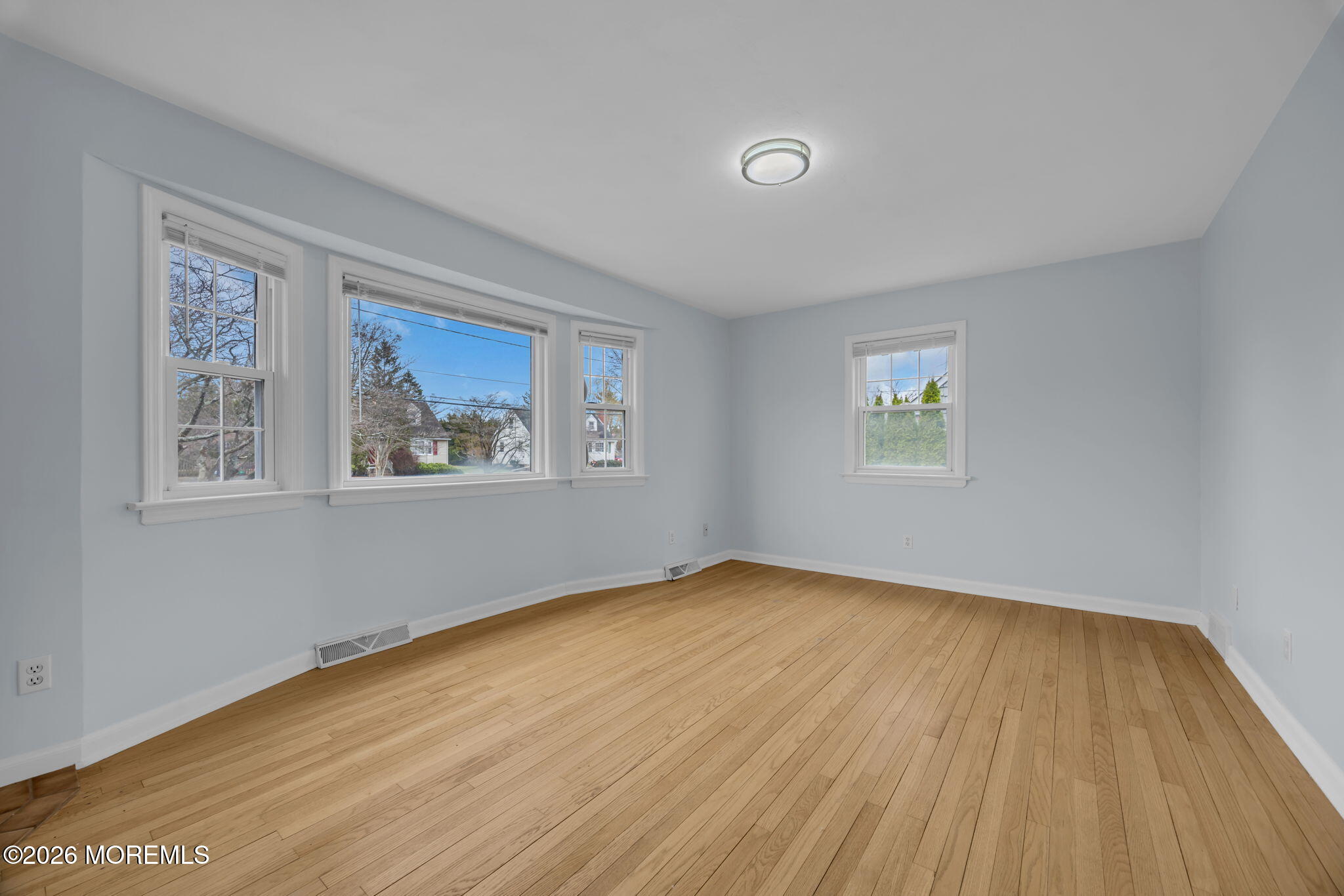 108 Susan Drive Ewing, NJ 08638 - Photo 19 of 40 a view of an empty room with wooden floor and a window